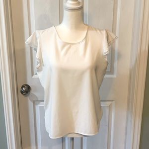 White blouse with lace trimmed sleeves No tags but appears to be a Junio…